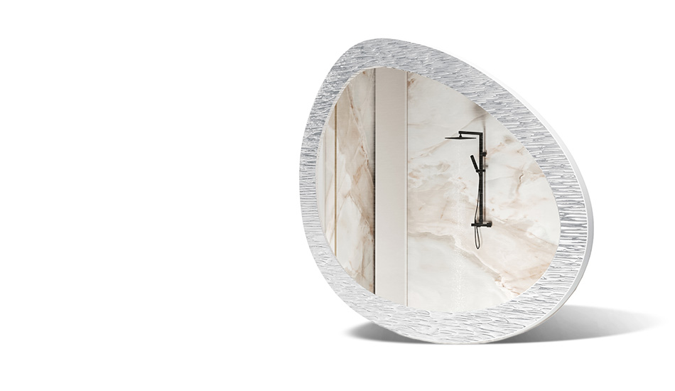 Mirror in a frame with metal decoration. A symbol of modern elegance